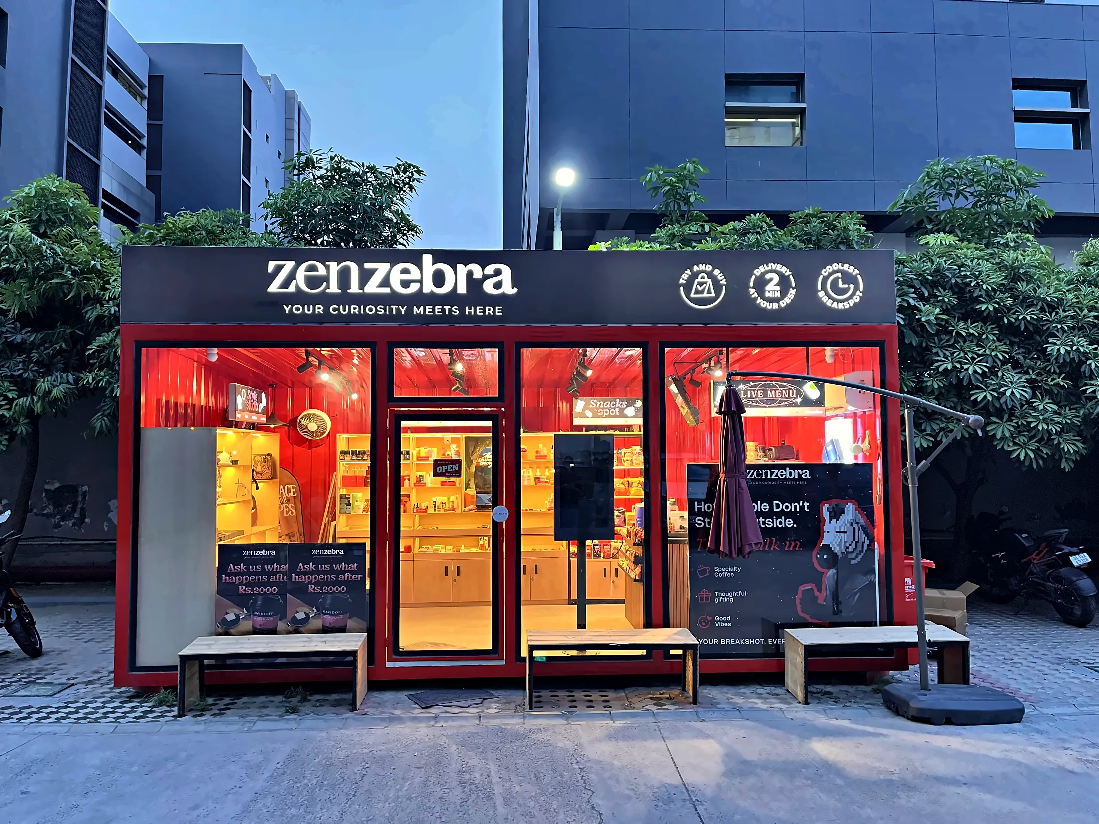 A ZenZebra store at night, red and glowing